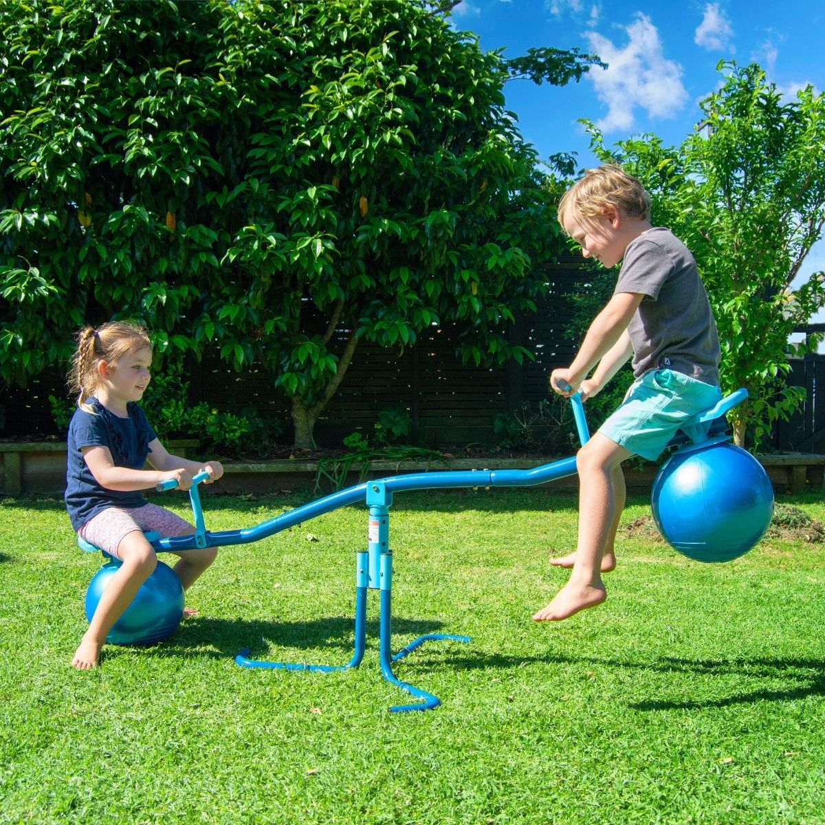 Kids Playing On Bouncing Bubble See Saw
