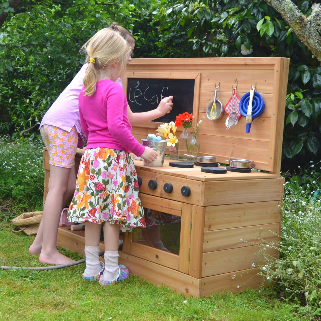 Girls Playing With Outdoor Play Kitchen