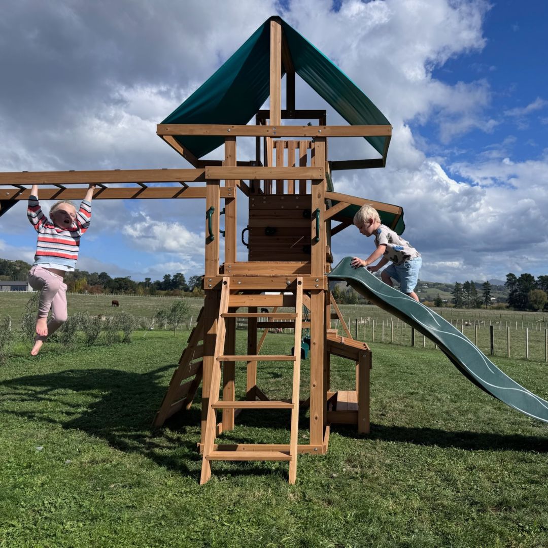Crow's Nest Play Centre With Children Playing On Monkey Bars And Slide