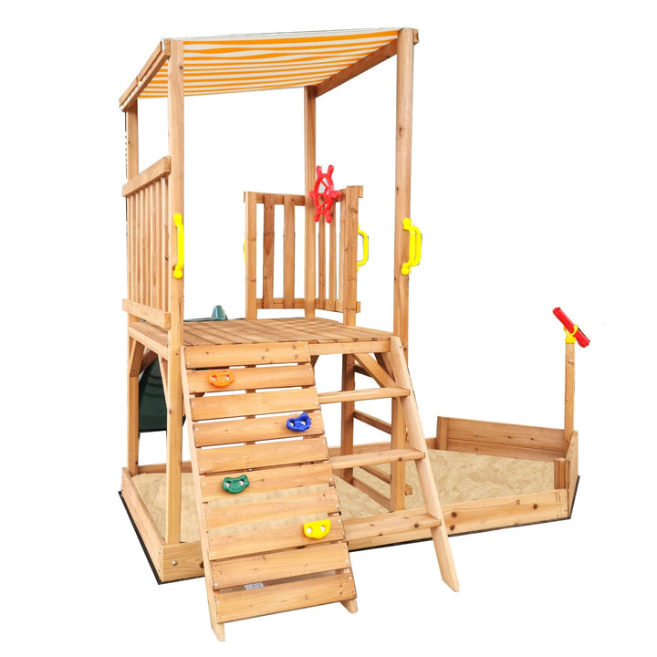 Ships Ahoy Play Centre from side with rock climbing wall and wooden ladder