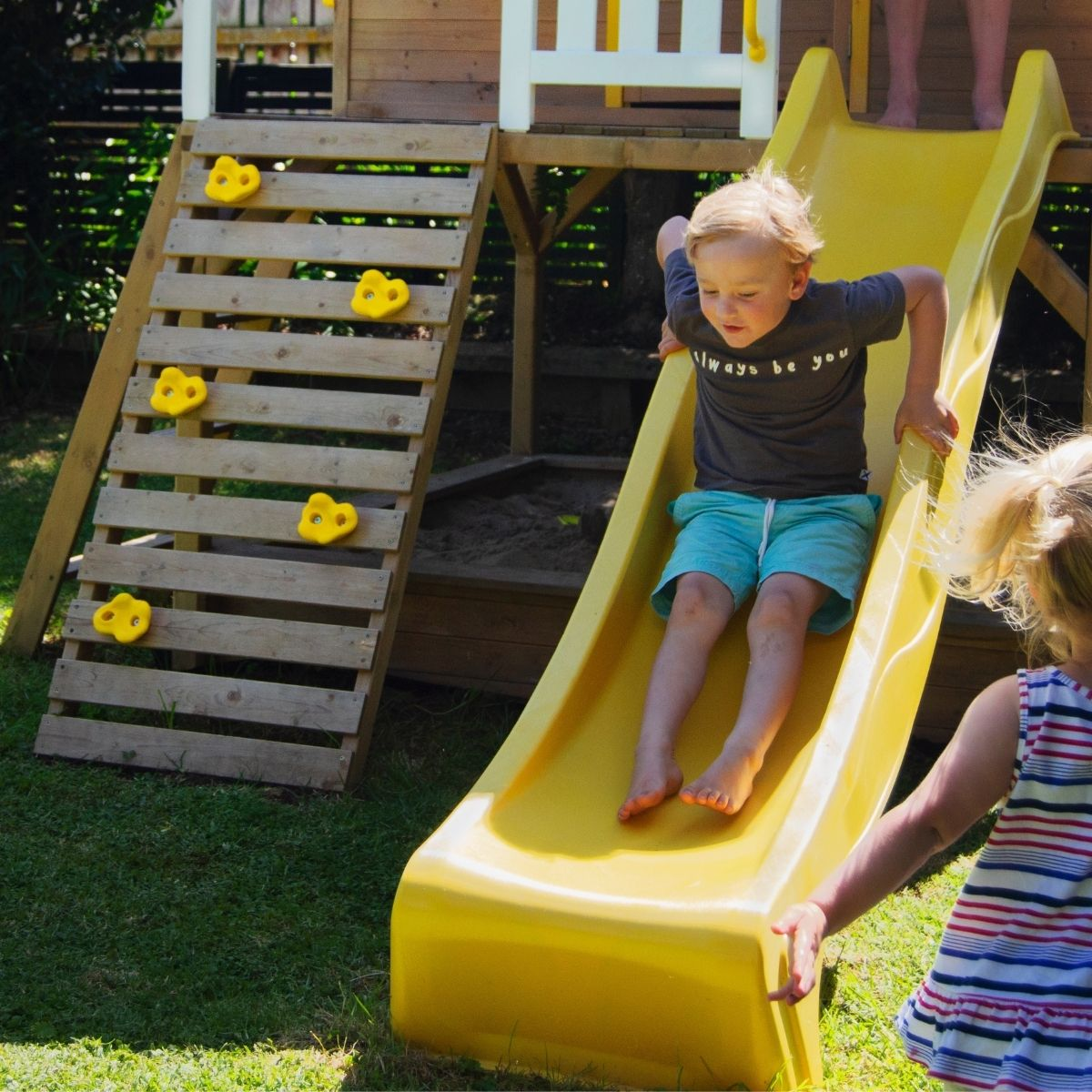 Kid going down slide.