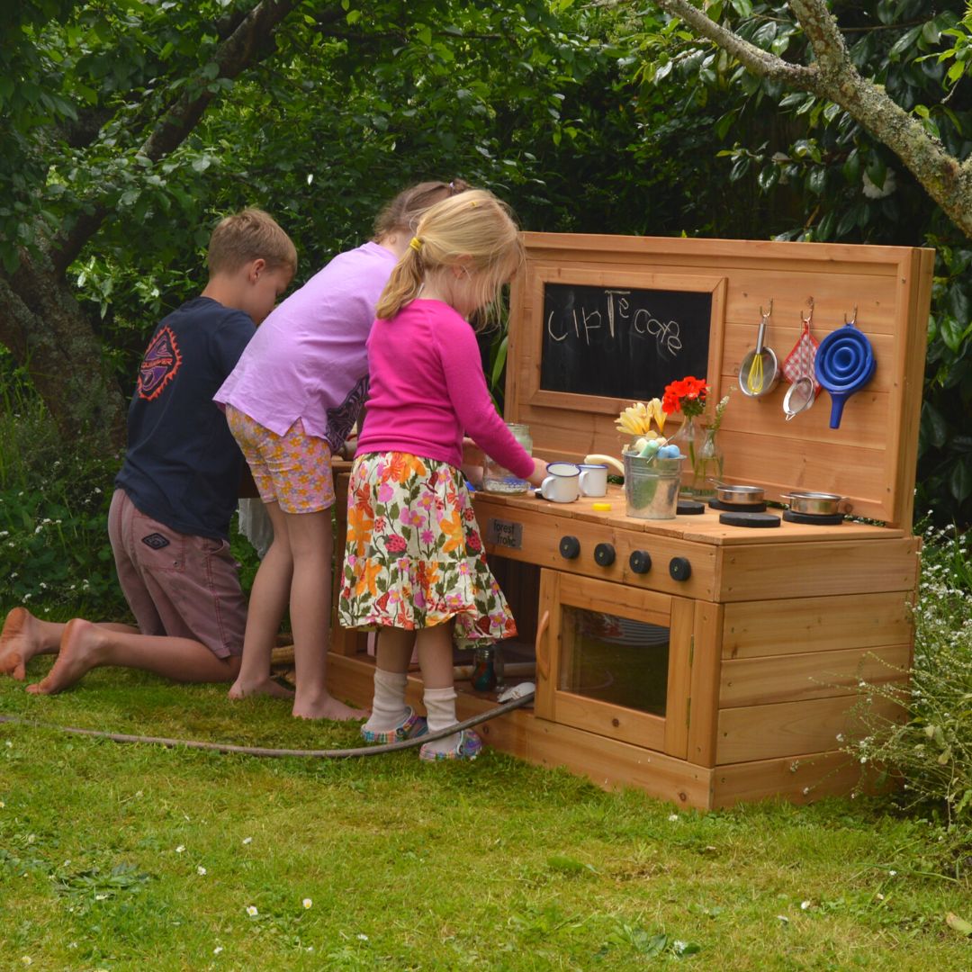 Forage And Find Mud Kitchen Three Kids Playing