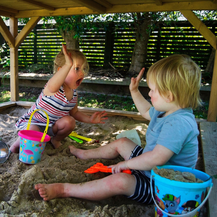 Children Playing In The Ranger Playhouse Sandpit